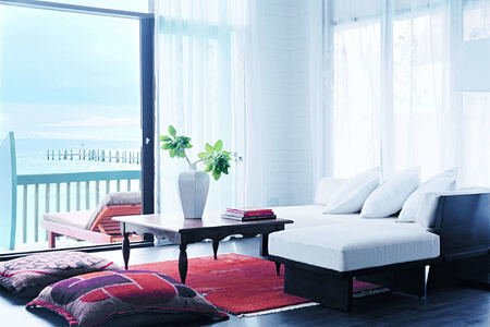 dhoni loft suite living room at Cocoa Island by COMO Resort Maldives