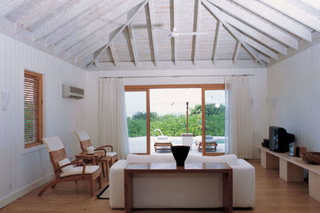 one bedroom villa living room at como parrot cay resort caribbean