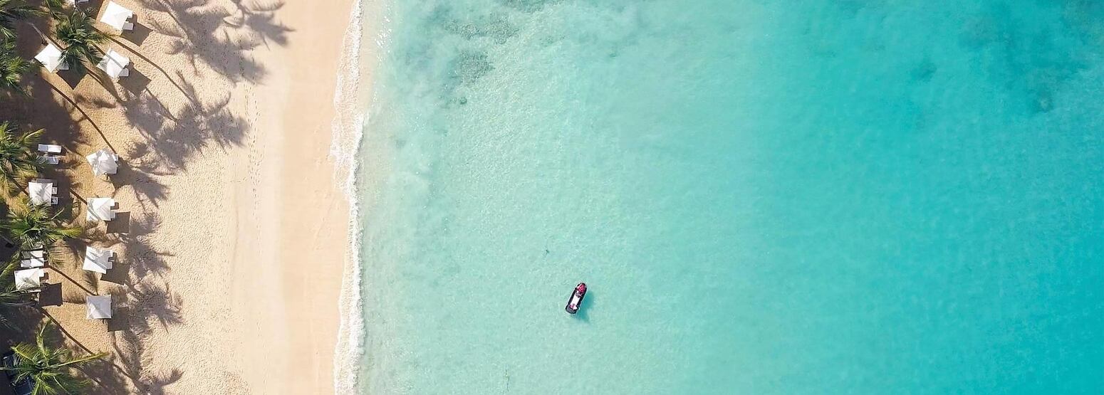 aerial beach view of boat at fairmont royal pavilion hotel barbados