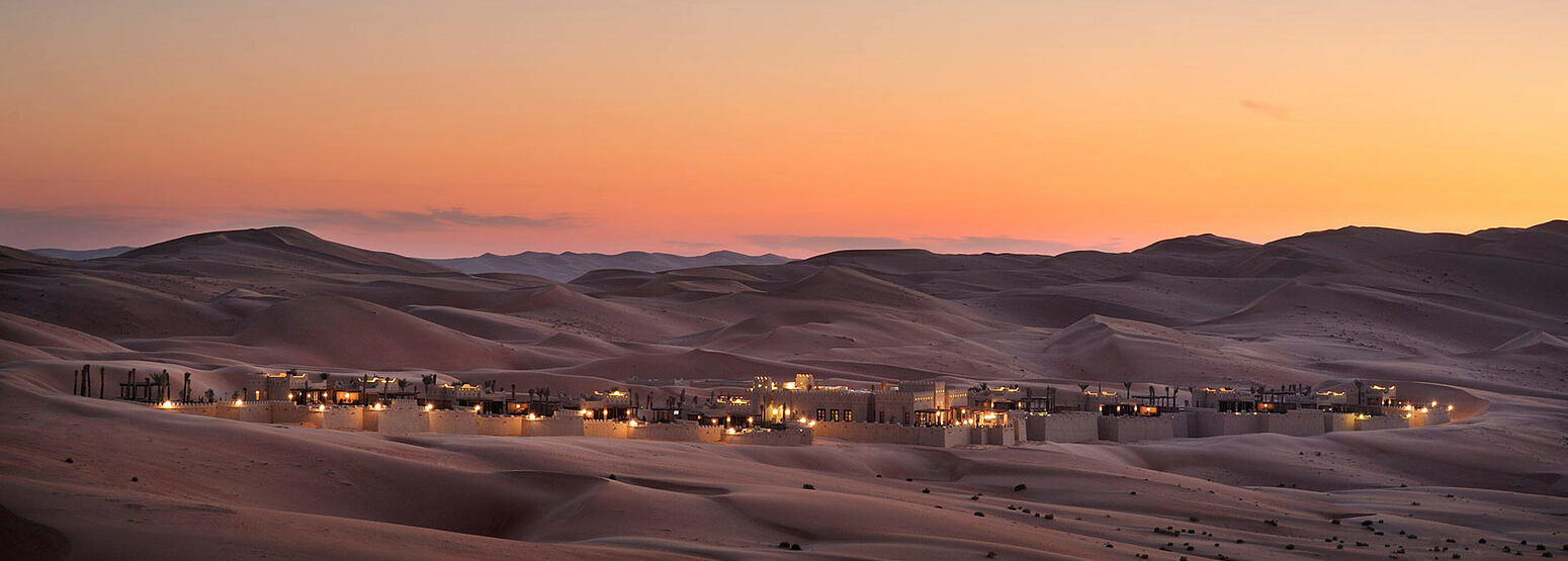 Beautiful twilight across the sand dunes at Anantara Qasr al Sarab