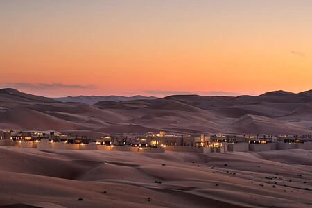 Beautiful twilight across the sand dunes at Anantara Qasr al Sarab