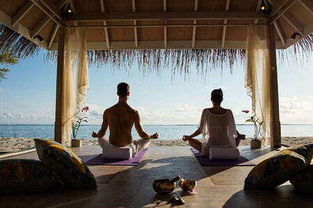 sunrise yoga at Kanuhura hotel Maldives