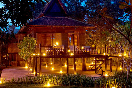 Khmer Village House Exterior Night at amansara hotel cambodia