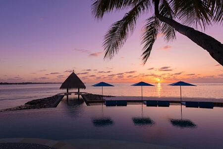 sunset at four seasons kuda huraa resort maldives