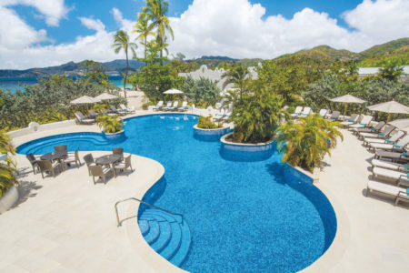 oasis swimming pool swim up jacuzzi at spice island beach resort caribbean