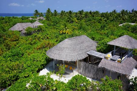 ocean beach villas aerial at six senses laamu hotel maldives