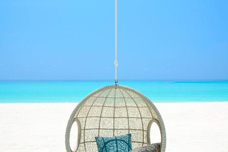beach club hanging chair at reethi rah resort maldives
