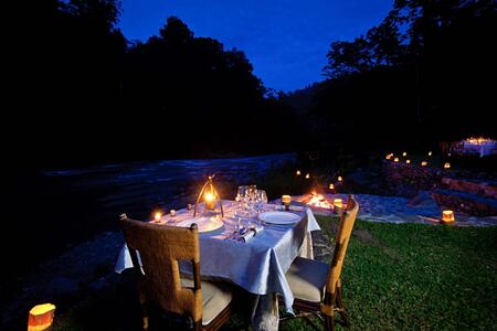 Outdoor evening dining Pacuare Lodge Costa Rica