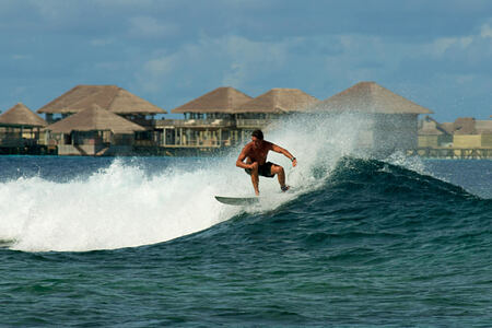 surfing at six senses laamu hotel maldives