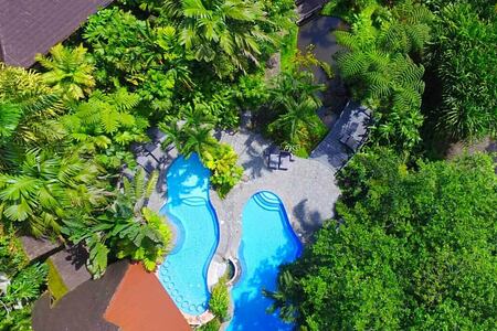 aerial view of swimming pools at lost iguana hotel costa rica