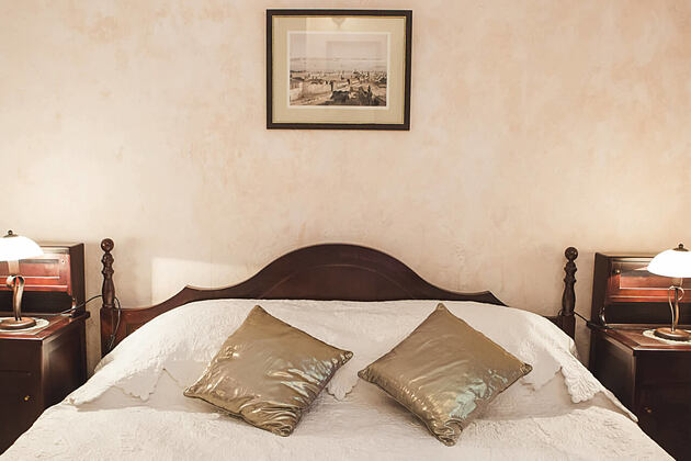 attic suite bedroom at palazzo radomiri hotel montenegro
