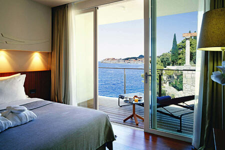 deluxe suite bedroom at sunrise at villa dubrovnik croatia