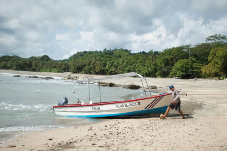 fishing boat on the beach at flor blanca resort costa rica