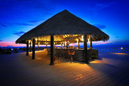 sundowners bar at sunset at Bandos Island Resort Maldives