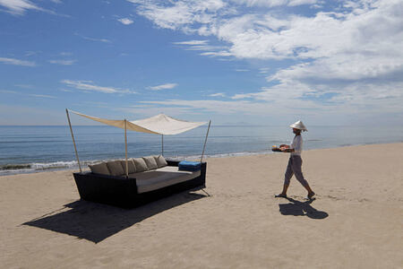 the beach with day bed at fusion maia resort vietnam