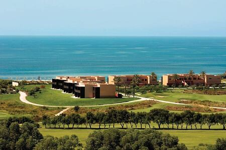view of accommodation and beach beyond at Verdura Resort Italy