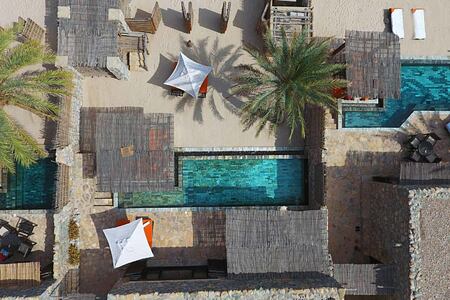 Aerial view of Pool Villa Suite Beach Front at Six Senses Zighy Bay Oman