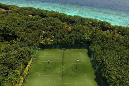 Aerial view of tennis courts at reethi beach resort maldives