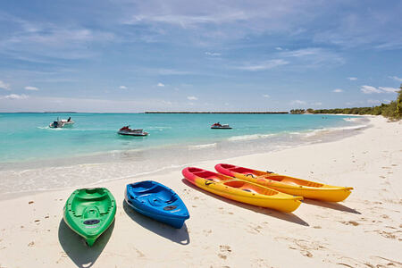 Kayaks on the beach at Hideaway Beach Resort Maldives
