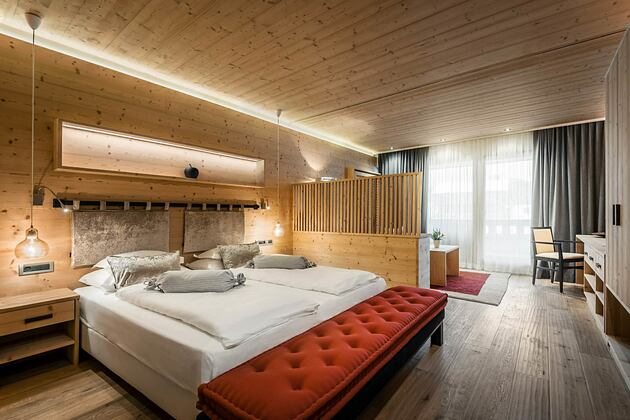 Large bedroom at Hotel La Majun Italy
