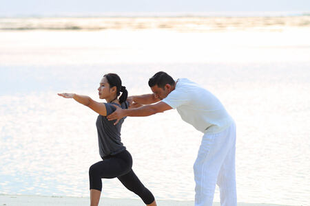 Private Yoga lessons on the beach at Gili Lankanfushi Maldives