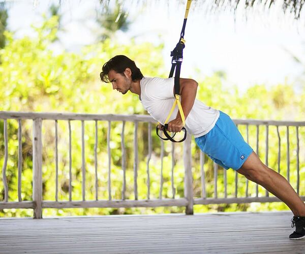 Man using ropes for fitness exercises at Six Senses Douro Valley Portugal