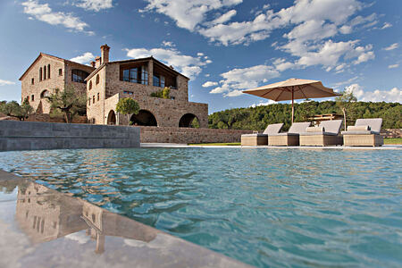 A view across the pool towards la Vella Farga Spain
