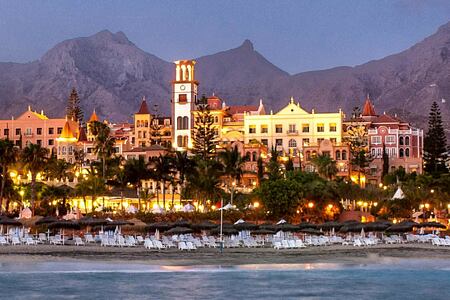 Beach and hotel it up at night at Gran Hotel Bahia del Duque Tenerife Spain