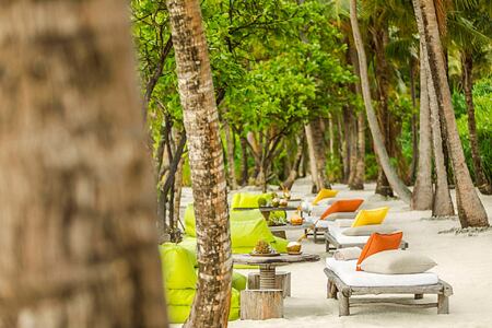 Beach chairs at Como Maalifushi Maldives