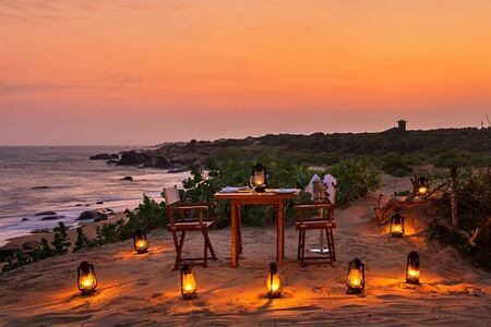 Beach dining at night at Chena Huts Sri Lanka