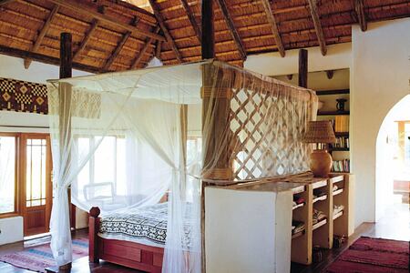 Bedroom with nets at Tangala House Zambia