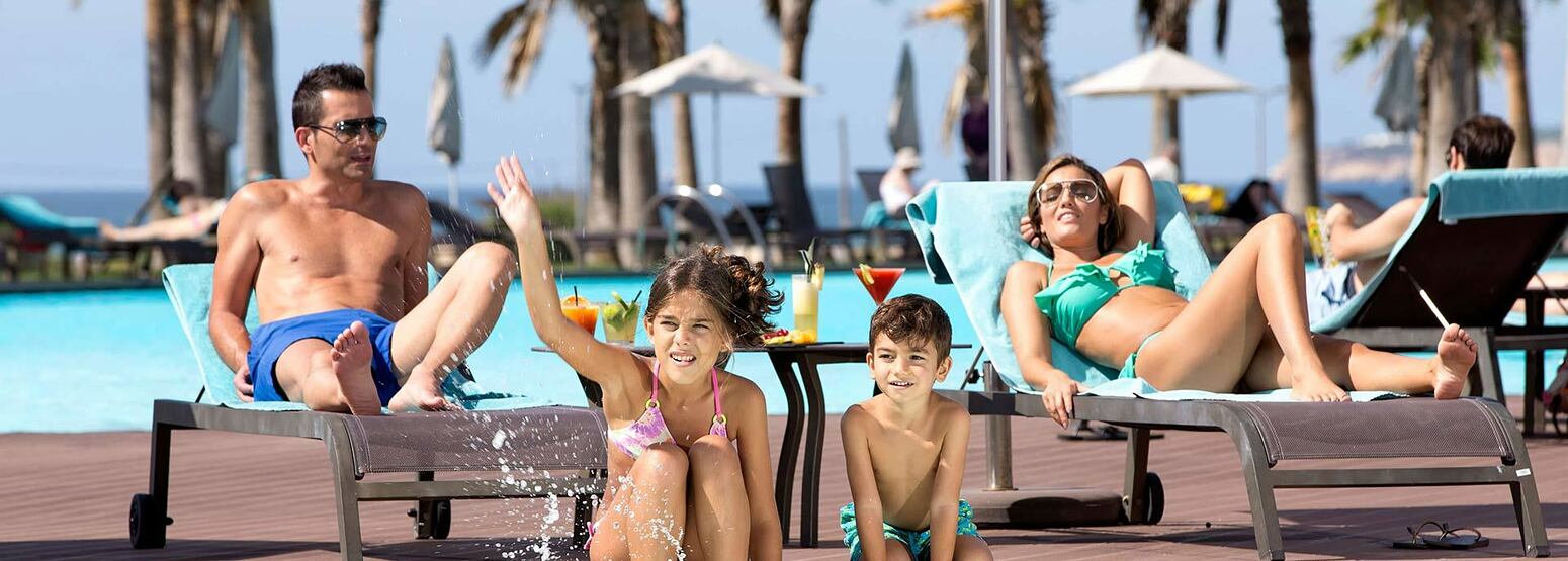 Family having fun at the pool at Vidamar Algarve Portugal