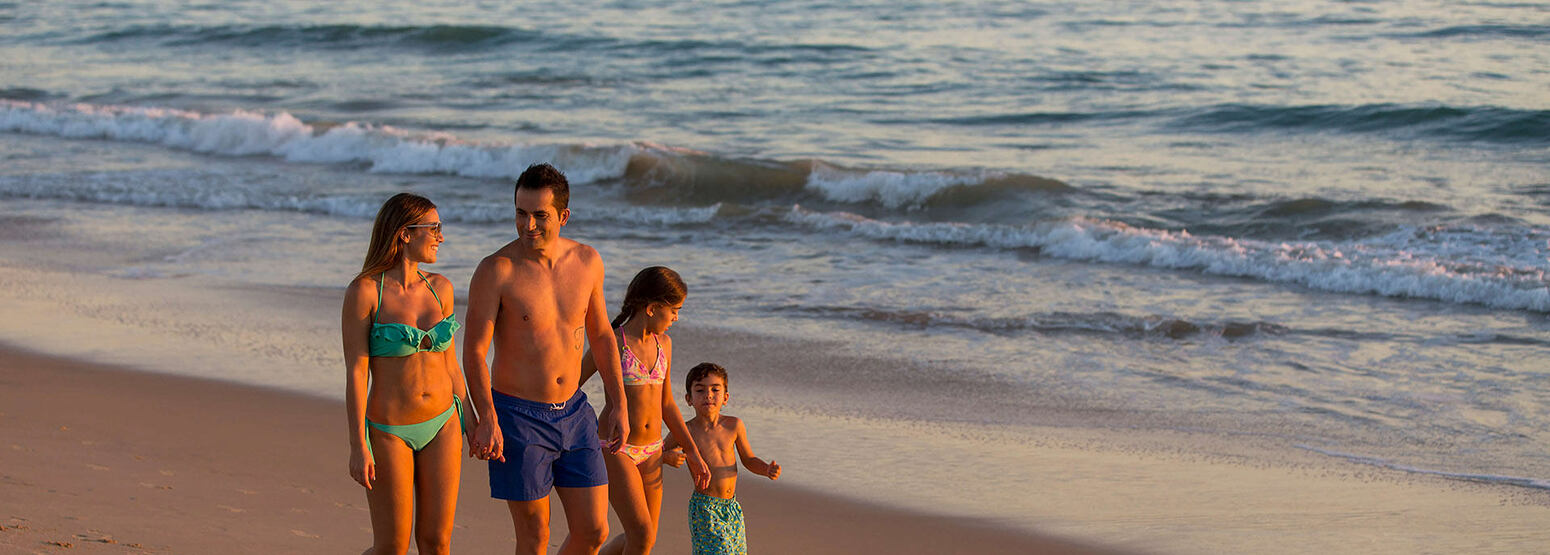 Family having fun on the beach at Vidamar Algarve Portugal