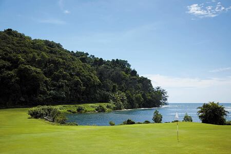 Golf course backed by jungle and sea at Shangri la Rasa Ria Borneo Malaysia