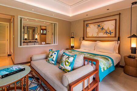 Junior Suite bed at Constance Lemuria Resort Seychelles
