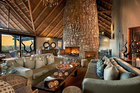 Main lounge with fireplace at Great Fish River Lodge South Africa