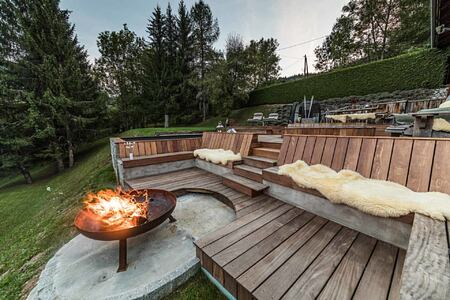 Outdoor seating and fire at Ferme de Moudon France