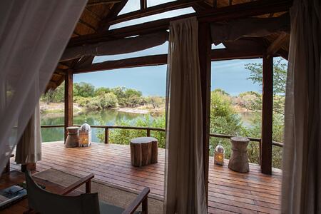 Relaxing view of Zambezi from room at Sindabezi Island Zambia
