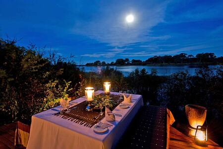 Romantic evening dining at Sindabezi Island Zambia