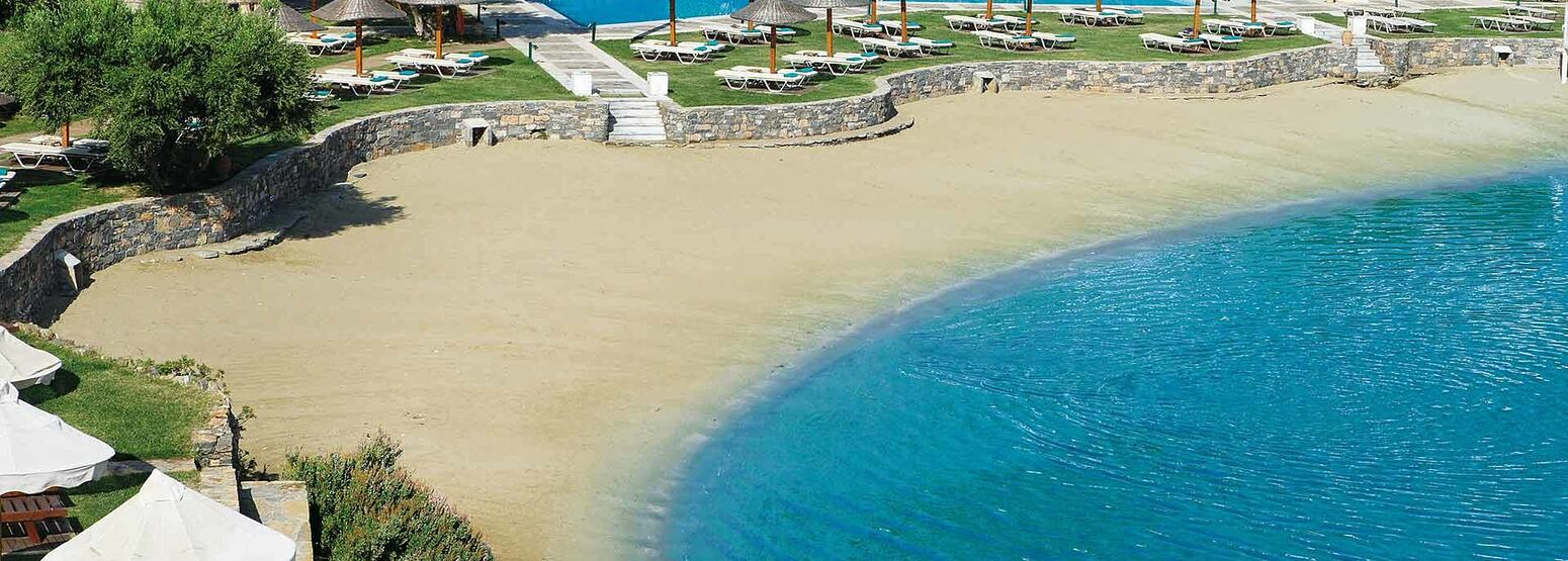 Sandy beach at Porto Elounda Golf and Spa Crete
