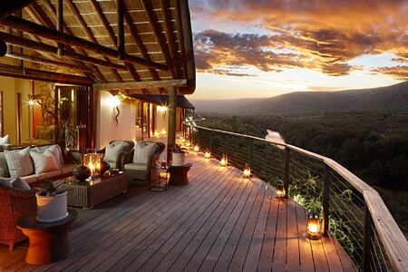 Suite and balcony over river at dusk at Great Fish River Lodge South Africa