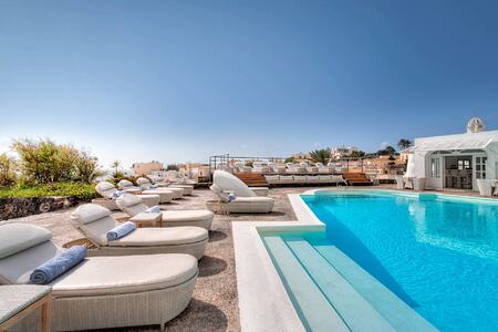 Sun beds by the pool at Vedema Santorini Greece