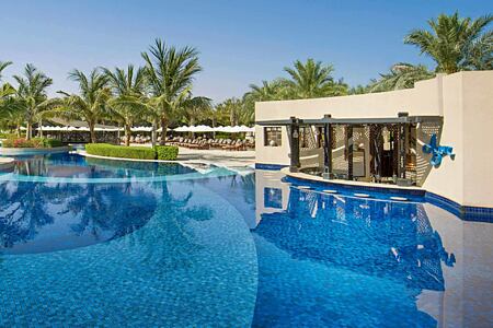 pool and pool bar at Waldorf Astoria UAE