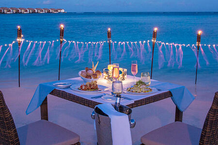Dinner by the beach at The Residence Maldives