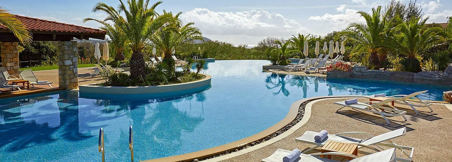 Lagoon pool and chairs at Westin Resort Costa Navarino Greece