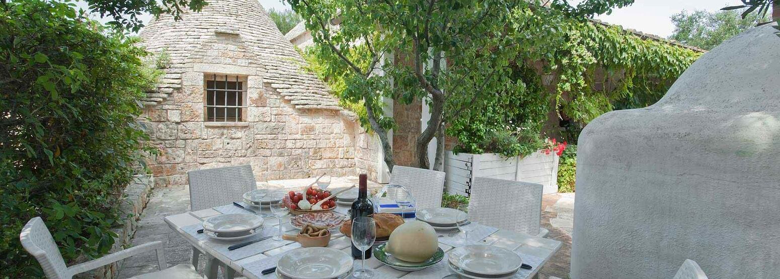 Outdoor dining at Trulli Volpe Italy