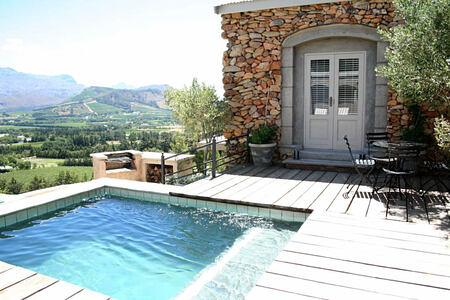 Hillside Cottage pool and view across mountains
