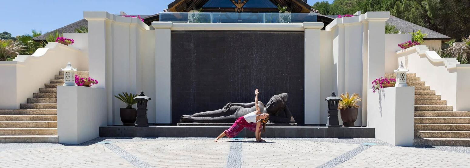 Woman enjoying yoga outside Shanti Som in Spain