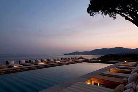 Sunset view across the pool and sea at Lily of the Valley France