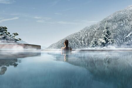 Lefay Dolomites outdoor pool winter woman